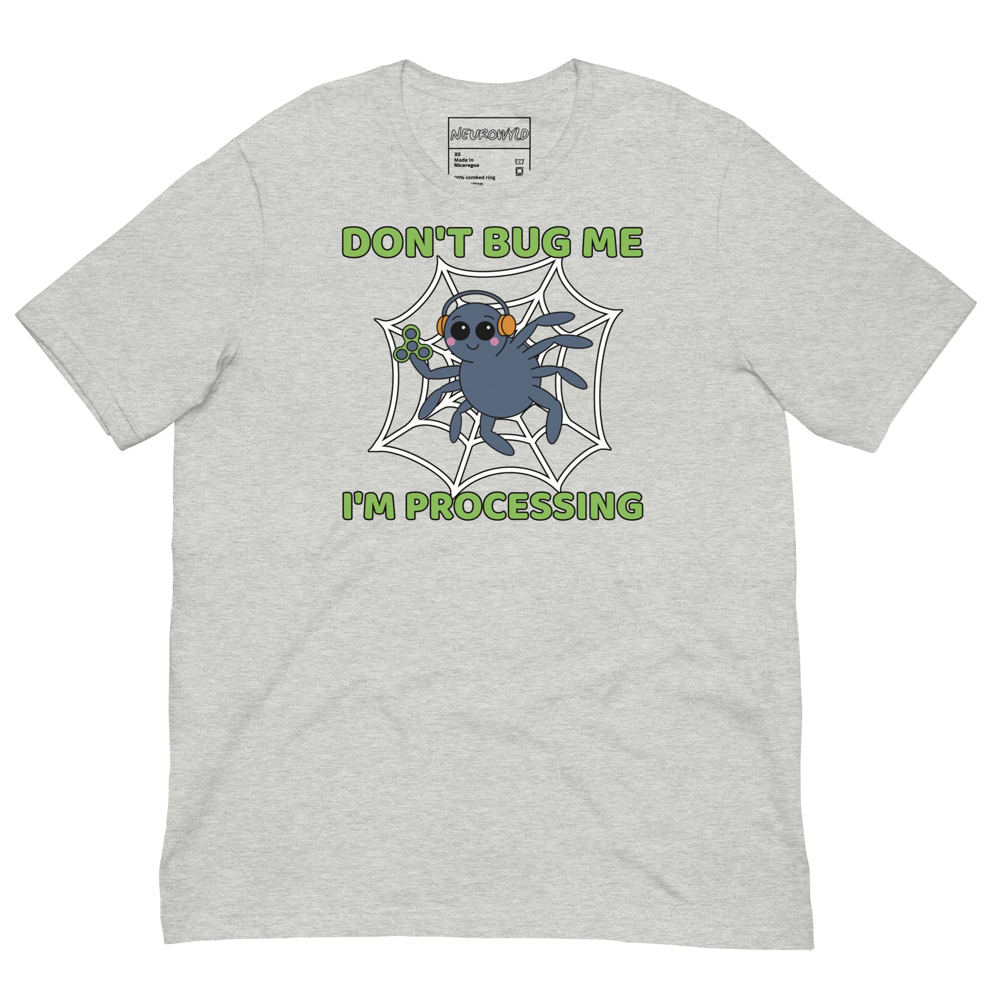 Light gray t-shirt featuring a cartoon spider sitting in a web, wearing orange headphones and holding a green fidget spinner. Above the spider, bold green text reads 'Don't Bug Me,' and below it says 'I'm Processing'.