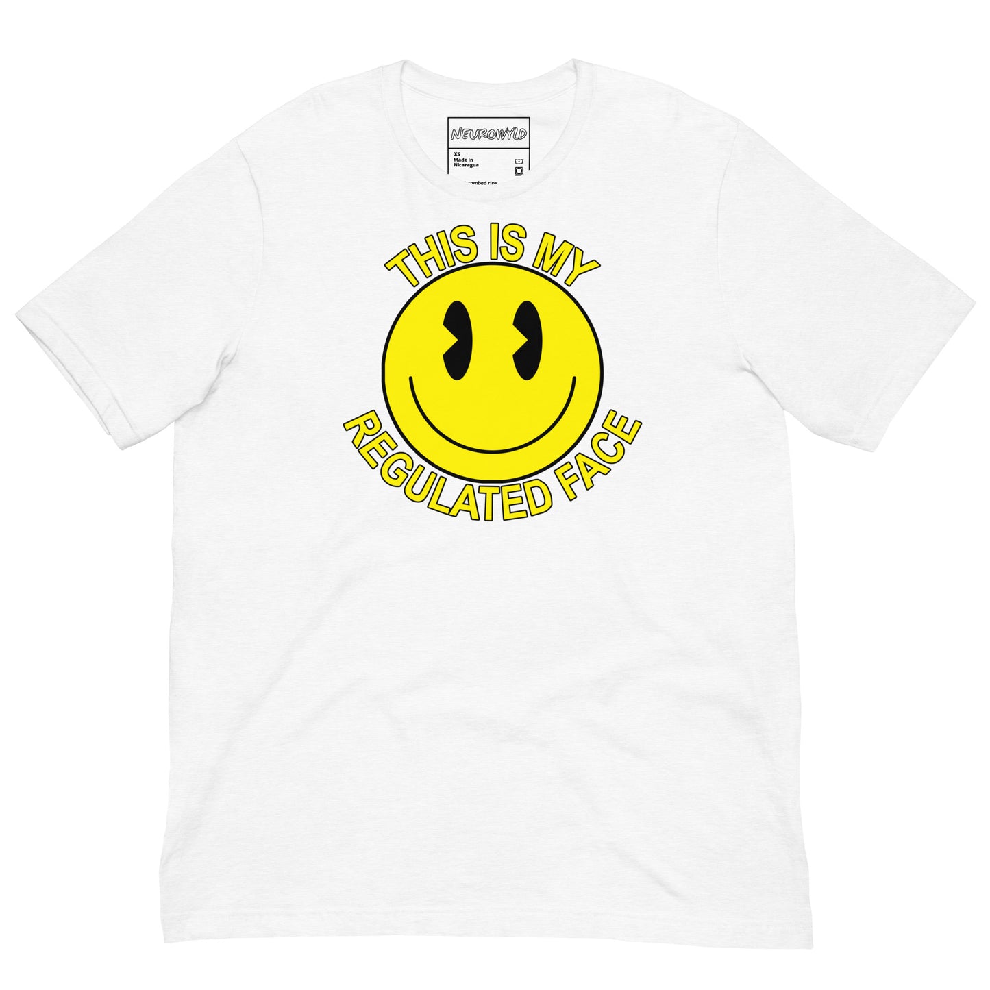 White t-shirt with a large yellow smiley face graphic. Text above and below the face reads ‘This Is My Regulated Face,’ combining humor and neurodivergent pride.