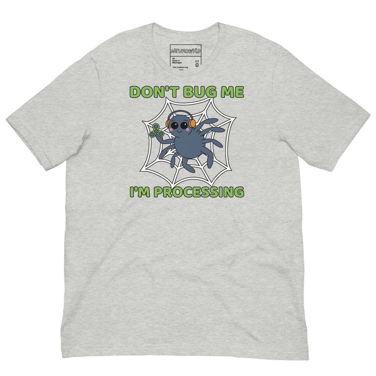 Light gray t-shirt featuring a cartoon spider sitting in a web, wearing orange headphones and holding a green fidget spinner. Above the spider, bold green text reads 'Don't Bug Me,' and below it says 'I'm Processing'.