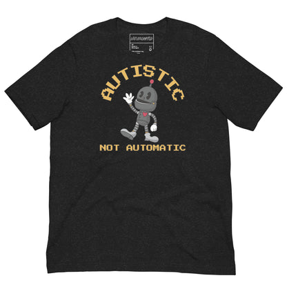 Black t-shirt with a cartoon robot graphic and pixel-style text that reads ‘Autistic Not Automatic,’ celebrating neurodiversity with retro design flair.