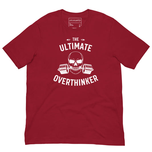 red t-shirt featuring a bold white graphic of a skull biting a barbell with weights. Above and below the design, text reads: 'The Ultimate Overthinker.'