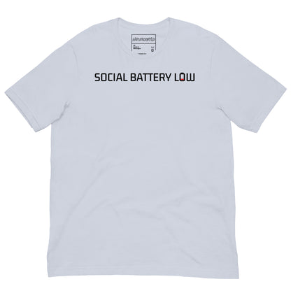 Light blue t-shirt with bold black text reading ‘SOCIAL BATTERY LOW,’ featuring a small red low-battery icon at the end, symbolizing introvert and neurodivergent humor.