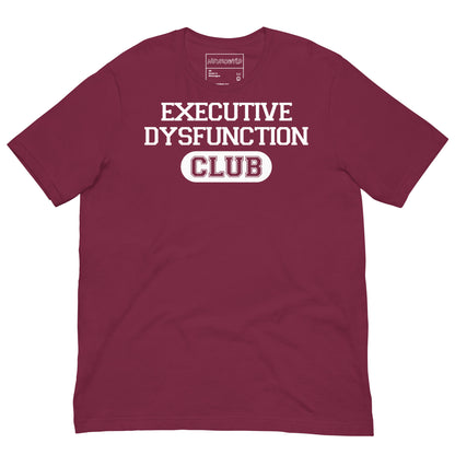 Maroon t-shirt with bold white text that reads ‘EXECUTIVE DYSFUNCTION CLUB,’ designed in a collegiate varsity style font, celebrating neurodivergent humor and identity.
