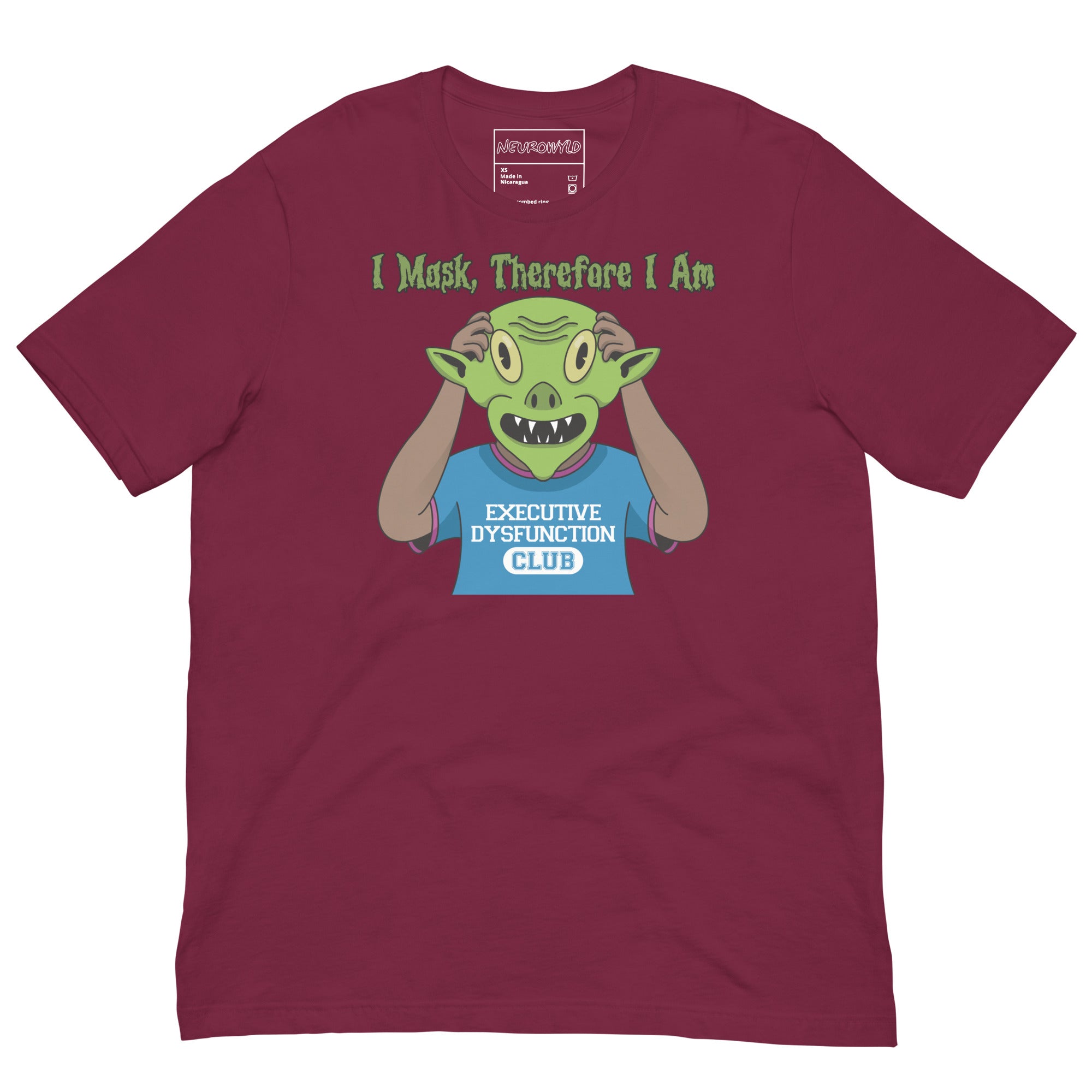 maroon t-shirt featuring a cartoon character wearing a blue 'Executive Dysfunction Club' shirt, holding up a green alien mask. Text above reads: 'I Mask, Therefore I Am' in spooky-style font.