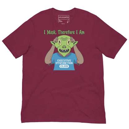 maroon t-shirt featuring a cartoon character wearing a blue 'Executive Dysfunction Club' shirt, holding up a green alien mask. Text above reads: 'I Mask, Therefore I Am' in spooky-style font.