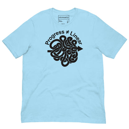 Blue t-shirt with a bold black graphic of a winding arrow forming a knot, paired with the phrase ‘Progress ≠ Linear’ above the design.
