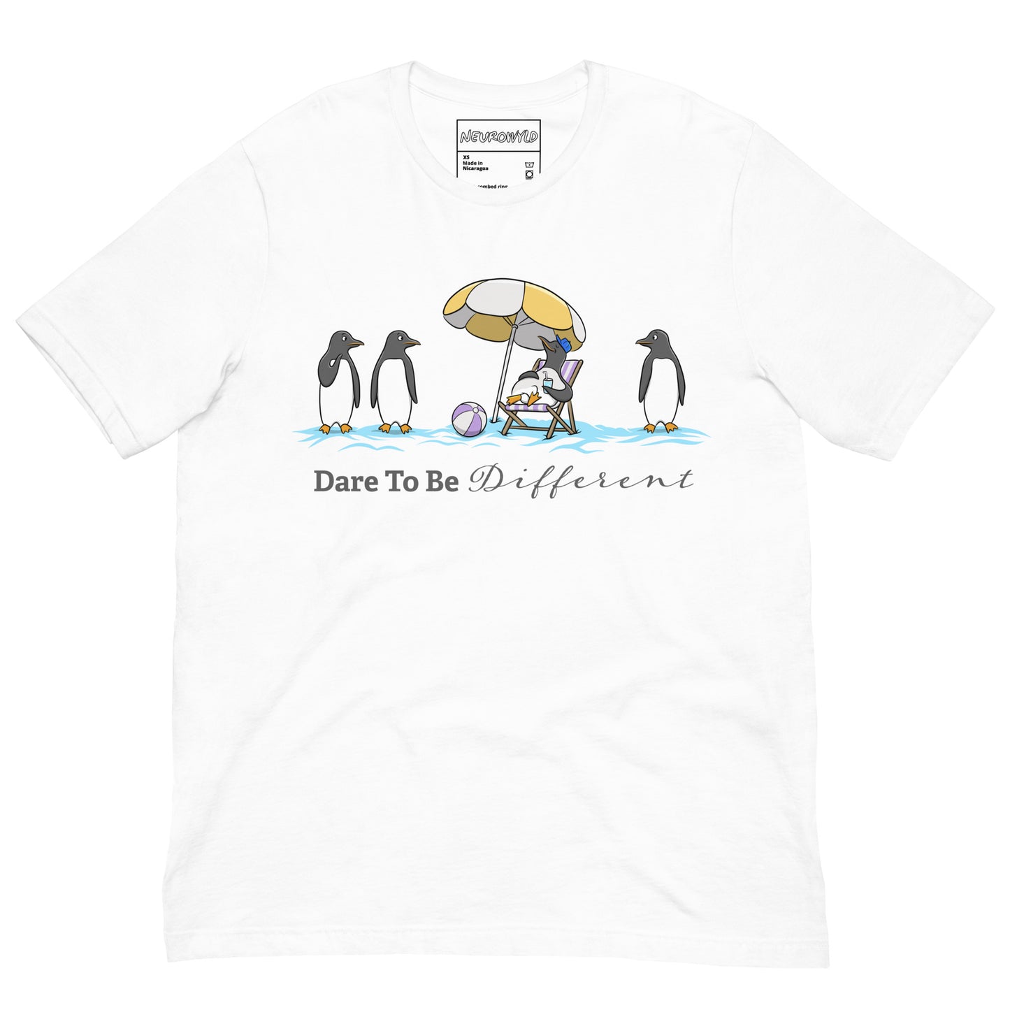 white t-shirt featuring three penguins standing in a row while a fourth penguin lounges under a beach umbrella with a drink, surrounded by sand and a beach ball. Below the illustration, the text reads 'Dare To Be Different' in bold and script font.