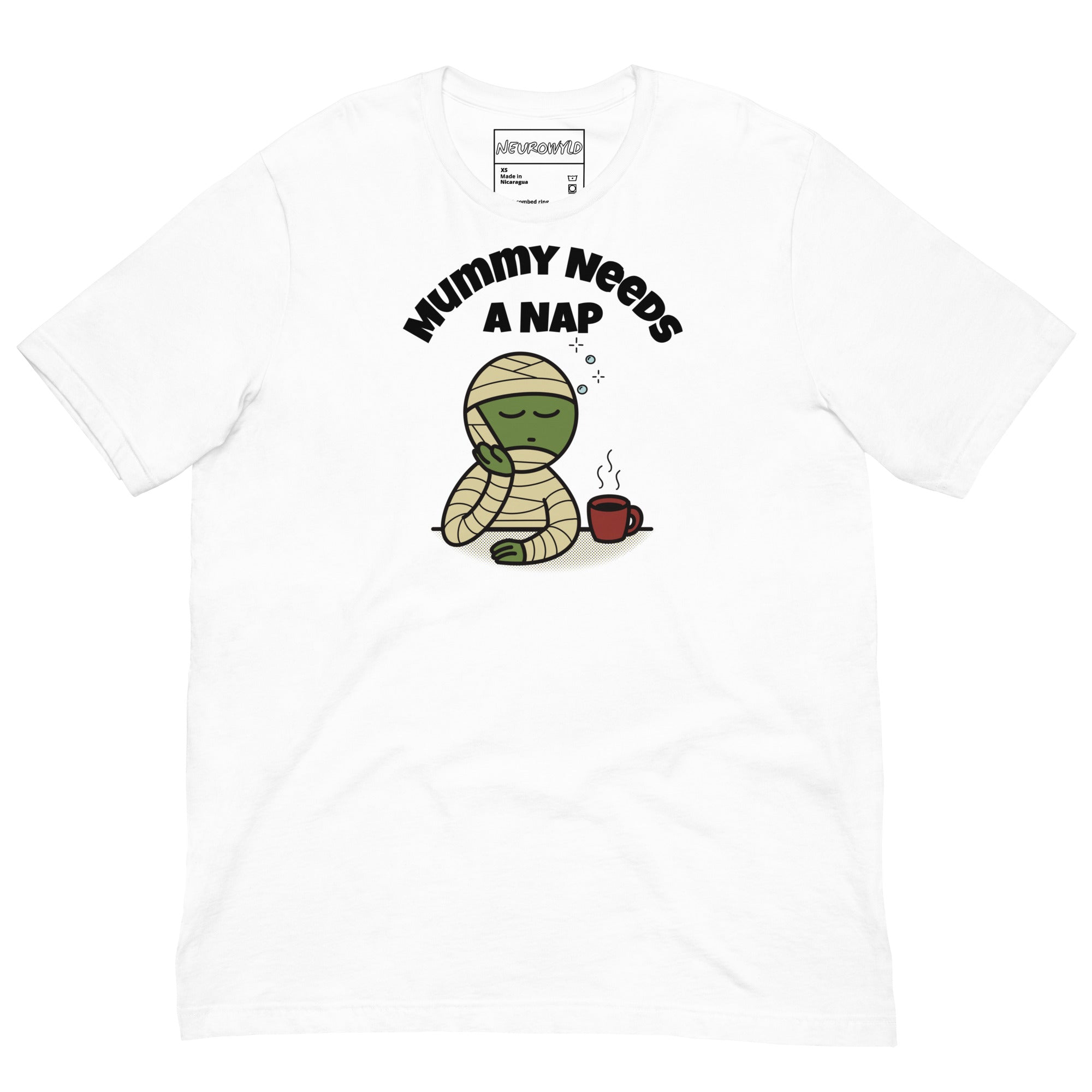 white t-shirt featuring a sleepy green mummy resting its head on one hand beside a steaming coffee cup. Above, the text reads 'Mummy Needs A Nap' in bold black letters.